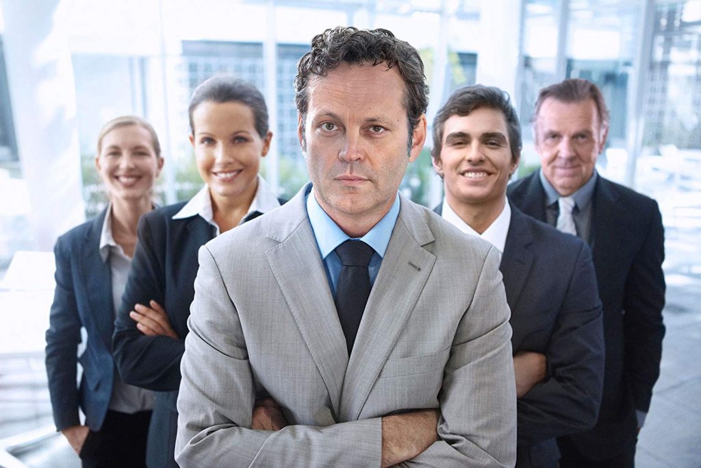 Vince Vaughn and the cast of Unfinished Business posing for every generic stock photo ever.